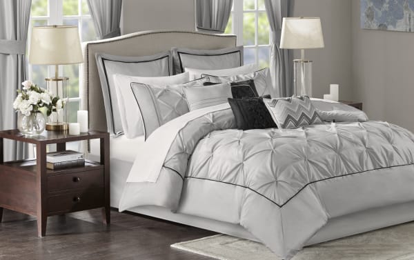 Alan Queen Gray Solid 24 Piece Comforter Set in contemporary gray polyester fabric with black accents, including comforter, pillows, sheets, valances, and bed skirt for a complete bedroom makeover.