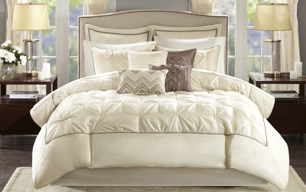 Alan Queen Ivory Solid 24 Piece Comforter Set in beige and brown polyester fabric with tufted design, includes comforter, pillows, shams, sheets, valances, and bed skirt for a contemporary bedroom makeover.