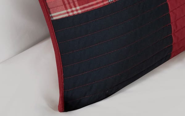 Red plaid cotton quilt corner from the Suny King/California King 3 Piece Quilt Set, featuring cottage-style fabric and stitched detailing.
