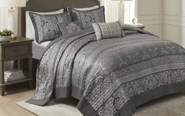Taylor King Gray Stripes 5 Piece Bedspread Set in gray and light gray polyester-cotton fabric, featuring traditional floral and stripe patterns, includes two shams, two accent pillows, and a quilted coverlet for a cozy, stylish bedroom.