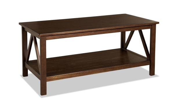 Apollo Brown Coffee Table from Apollo Entertainment & Occasional collection, transitional style in brown pine solids and MDF with geometric side design and lower shelf.