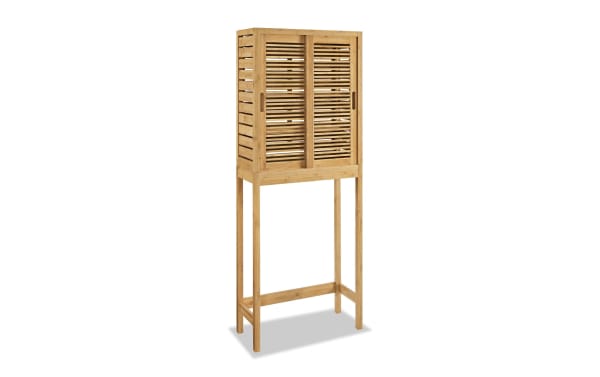 Branson Natural Over the Toilet Space Saver Cabinet in bamboo with two sliding slatted doors, three shelves, and tall legs for small bathroom storage.