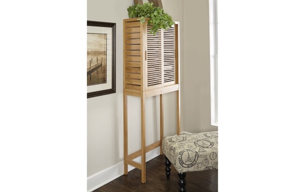 Branson Natural Over the Toilet Space Saver Cabinet in bamboo with sliding slatted doors, three shelves, and tall legs for small bathroom storage.
