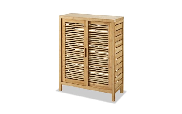 Branson Natural Floor Cabinet in transitional style, made of natural bamboo with two slatted doors and three interior shelves for bathroom storage.