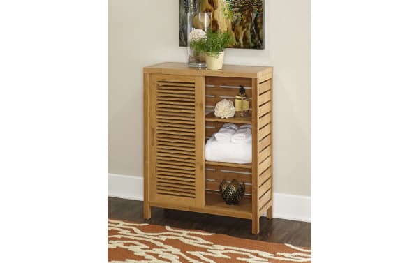 Branson Natural Floor Cabinet in bamboo with two sliding doors and three shelves, transitional style for bathroom storage.
