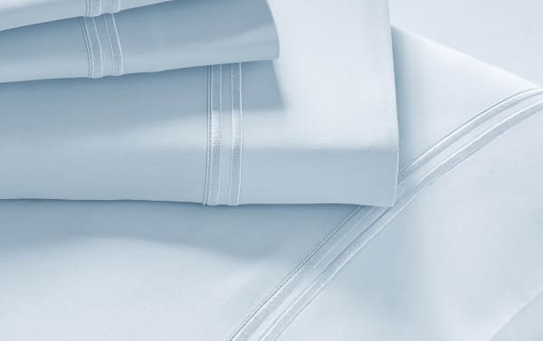 MyBob's Split Head Queen Light Blue Premium Modal 4 Piece Sheet Set with smooth sateen weave, elastic cuff fitted sheet, deep pockets, and traditional double-stitched trim.