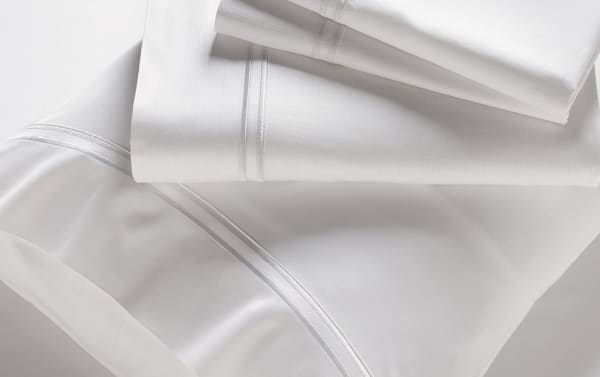 MyBob's Full White Solid Premium Rayon Bamboo 4 Piece Sheet Set with elastic cuff fitted sheet, flat sheet, and enveloping pillowcases in soft, traditional white sateen.