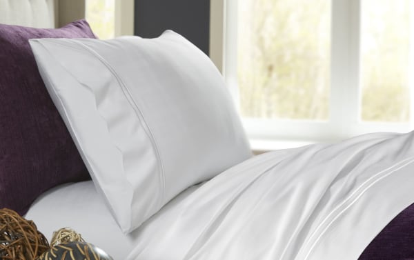 MyBob's Full White Solid Premium Rayon Bamboo 4 Piece Sheet Set with elastic fitted sheet, deep pockets, and enveloping pillowcases in traditional style.