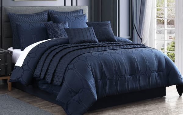 Desy King Blue Geometric 10 Piece Comforter Set in rich blue polyester fabric with a contemporary geometric pattern and plush pillows for upscale bedroom decor.