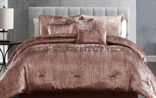 Zoey King Blush Solid 7 Piece Comforter Set with crinkled velvet polyester fabric in glam pink, includes comforter, shams, bedskirt, and accent pillows.