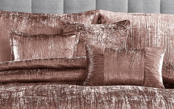Zoey King Blush Solid 7 Piece Comforter Set in blush pink crinkled velvet polyester fabric, glam style with comforter, shams, bedskirt, and accent pillows.