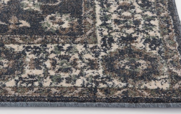 Blue and ivory Anny 5' x 7' traditional rug with intricate oriental pattern, made of durable, stain-resistant polypropylene for transitional style spaces.