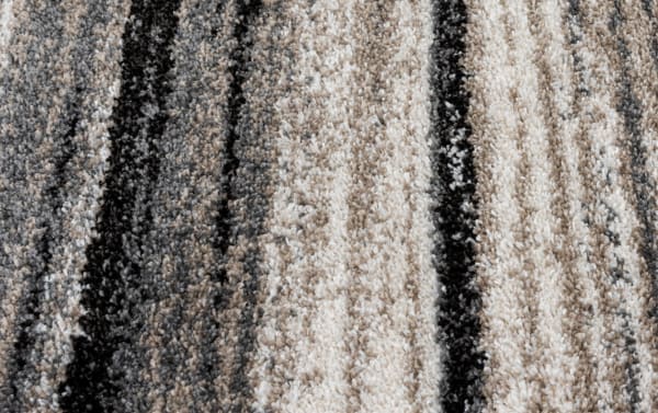 Transitional Bay 5' x 7' Gray Abstract Rug with modern striped pattern in gray, black, and taupe, made of durable, stain-resistant polypropylene.