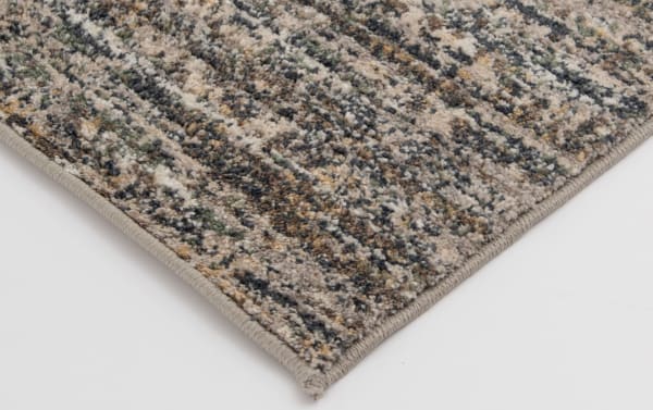 Transitional Alana 5' x 7' gray abstract rug with gray, brown, and beige tones, made of durable, stain-resistant polypropylene fibers.