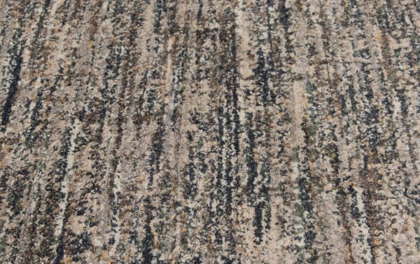 Transitional Alana 5' x 7' gray abstract rug with gray, brown, and beige tones, made of durable stain- and fade-resistant polypropylene.