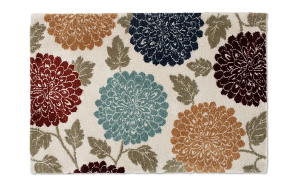 Carn 5' x 7' Ivory Floral Rug with multicolored orange, red, blue, and purple flowers on a polypropylene transitional style floor rug, cozy and decorative.