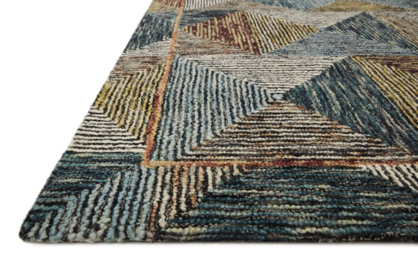 Contemporary Anara 2' x 4' wool rug with multicolored blue geometric pattern, featuring sea blue, gold, olive, and berry accents.