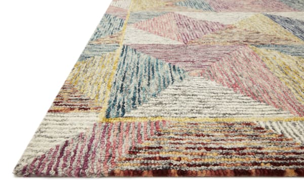 Contemporary Anara 5' x 8' wool rug with multicolored geometric pattern in shades of red, pink, blue, gold, and gray, handcrafted in India.