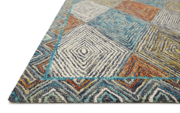 Contemporary Katyusha 5' x 8' Blue Geometric Rug in wool with vibrant multicolored diamond patterns in blue, gray, orange, and ivory tones.