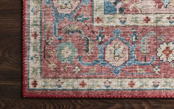 Traditional Matty 3' x 8' red oriental runner with multicolored floral patterns in polyester fabric, featuring berry, seafoam, blush, and teal accents on dark espresso wood floor.