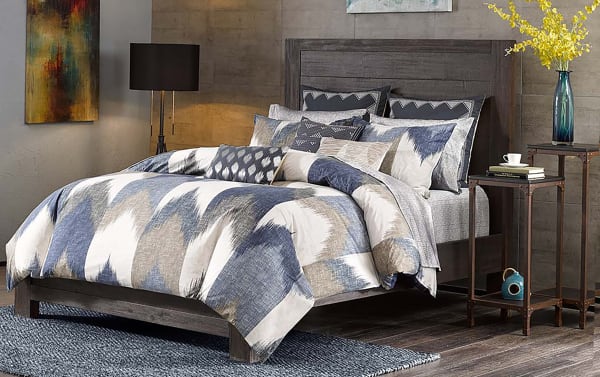 Moira King California King 3-piece cotton comforter set in navy, gray, white, and gold with modern broken chevron design and matching shams.