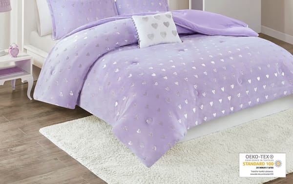 Juliette Twin/Twin XL Purple Hearts 3 Piece Comforter Set in plush purple polyester with metallic silver hearts, glam style, includes pompom-trimmed decorative pillow, OEKO-TEX certified for safety.
