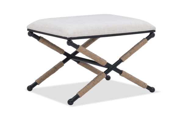 Traditional April White Upholstered Vanity Stool with white cotton blend fabric seat, black iron X-base frame, and rope-wrapped legs for versatile seating.