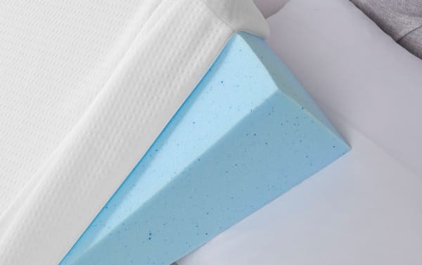 White transitional style Memory Foam Wedge Pillow with soft knit washable cover, designed for neck support and leg elevation.
