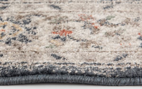 Close-up of the Cami 3' x 5' Black Oriental Rug showing soft polypropylene yarn in cream, gray, black, and yellow tones with a transitional medallion pattern and durable machine-made texture.