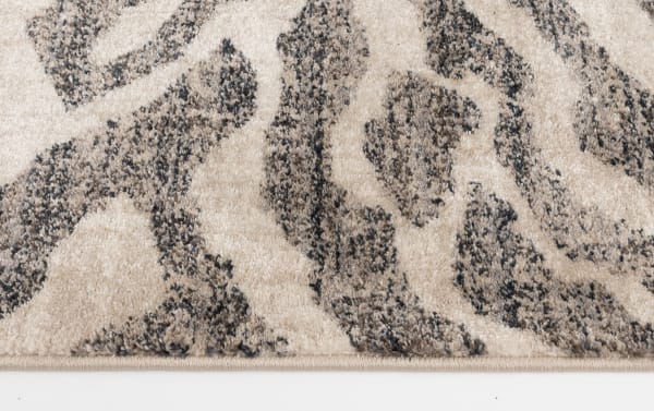 Hadid 5' x 7' gray and cream animal print rug in transitional style, made of soft, durable polypropylene for fade- and stain-resistance.