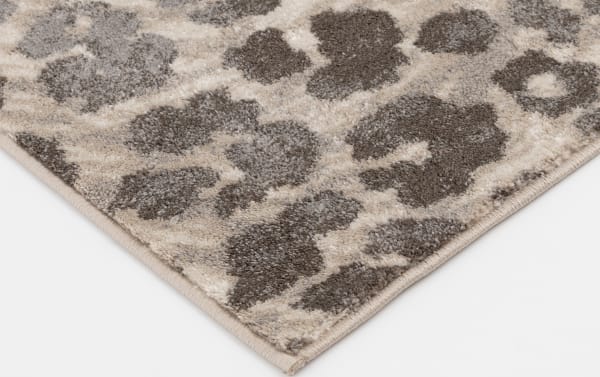 Sharma 8' x 10' gray animal print rug with cream and brown tones, transitional style, soft polypropylene material, durable and stain-resistant.