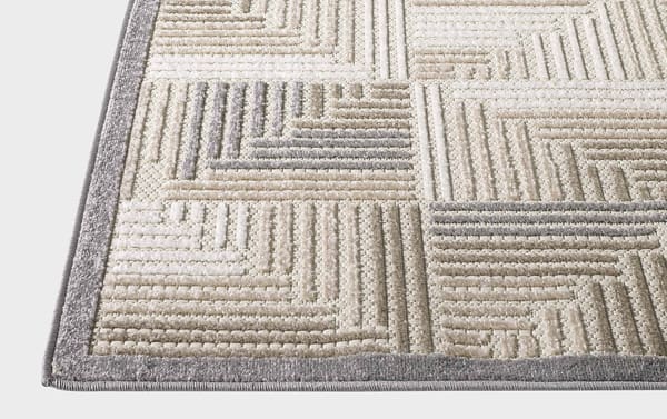 Beige Tae 2' x 3' indoor/outdoor rug with abstract geometric pattern in cream, gray, brown, taupe polypropylene fibers, stain and fade resistant.