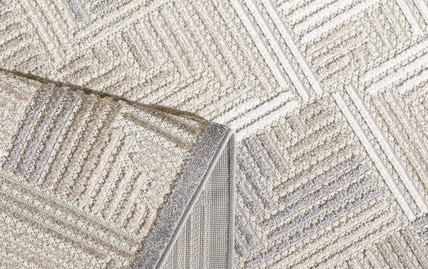 Beige Tae 2' x 3' indoor/outdoor rug with cream, gray, brown, and taupe geometric pattern, made of durable, stain-resistant polypropylene fibers.