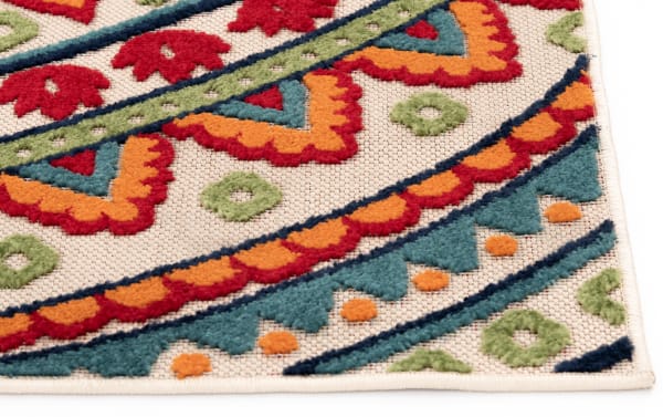 Transitional Mathis 6' x 9' multi medallion indoor/outdoor rug in durable polypropylene with red, blue, yellow, green, and orange geometric patterns.
