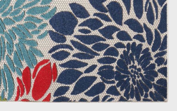 Beige Dodds 5' x 7' indoor/outdoor polypropylene rug with transitional floral pattern in blue, light blue, red, and green, durable for high traffic areas.