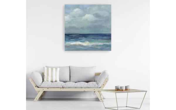 Transitional Clouds and Sea Crop III canvas wall art with multicolored blue seascape, printed on polyester fabric and hand-stretched over solid pine frame.
