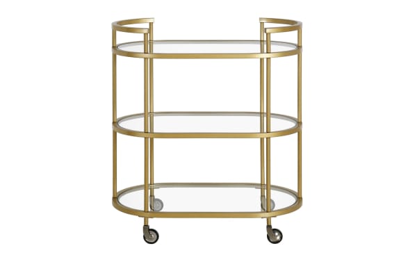 Alice Brass Bar Cart in glam style featuring three curved tempered glass shelves, brass steel frame, handles, and caster wheels for easy mobility.