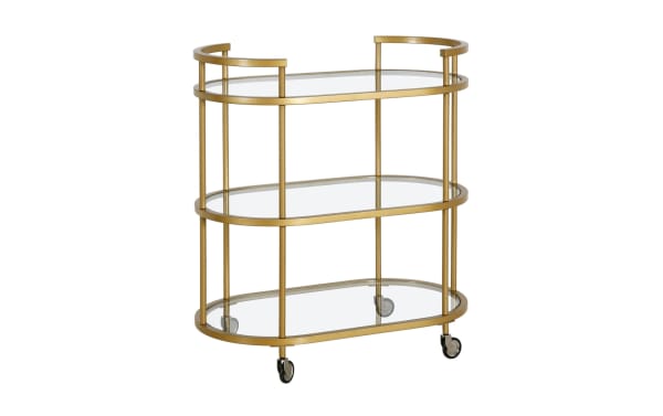 Alice Brass Bar Cart with glam style, featuring three curved tempered glass shelves and a gold steel frame. Includes handles and caster wheels for easy mobility. Ideal as a stylish bar cart, coffee station, or mobile vanity.