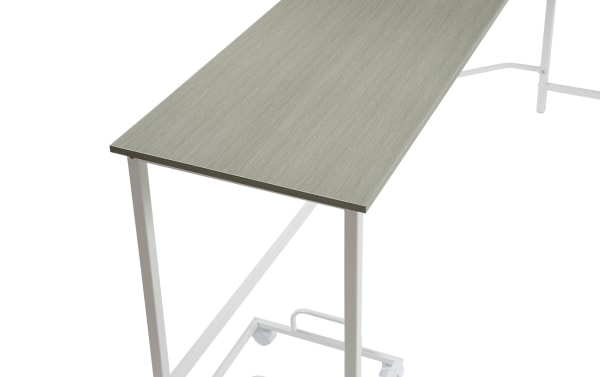 Contemporary Cora Gray Corner Desk with large gray composite wood top and white metal frame, designed for efficient corner workspace.