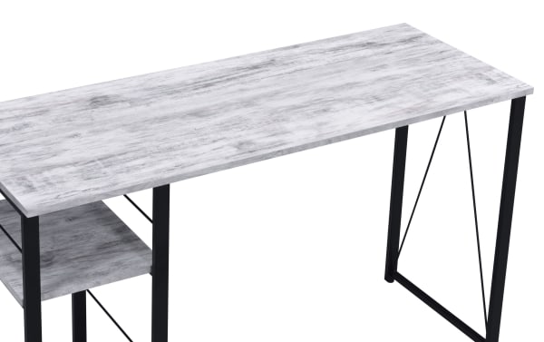 Contemporary Arlo White Writing Desk with large whitewashed veneer top, black metal frame, and two right-side storage shelves for books and devices.