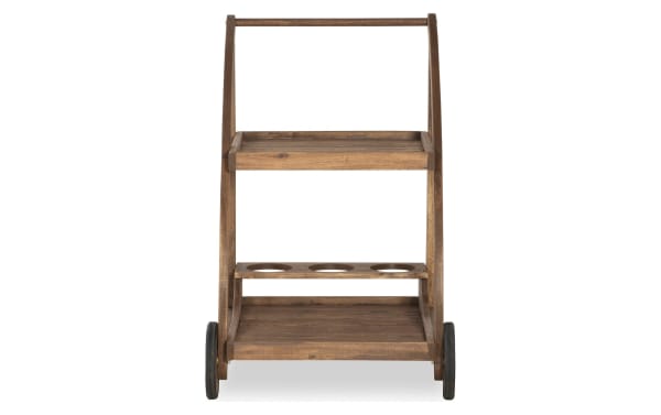 Walton Brown Outdoor Bar Cart in Acorn finish, solid Acacia wood, traditional style with two storage shelves, bottle holders, and large front wheels for easy mobility.