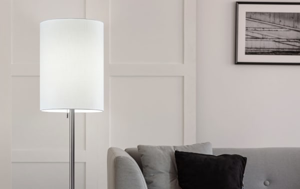 Calion 60.5'' Mid-Century Modern floor lamp with brushed steel pole, white textured fabric cylinder shade, pull chain, and compact square metal base.