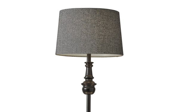 Alesandra 60'' black floor lamp with mid-century modern style, featuring a charcoal herringbone fabric drum shade and turned steel pole and base.