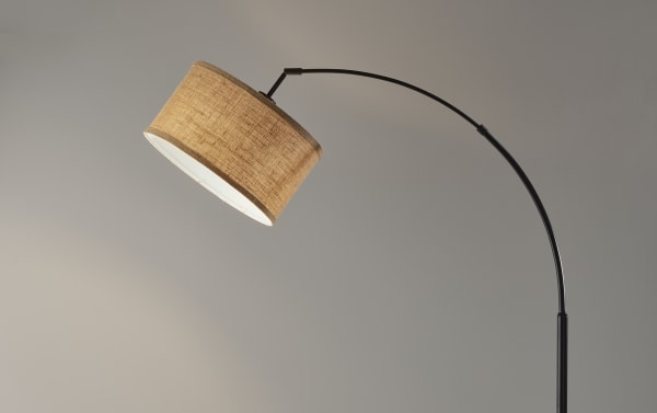 Romy 68'' Antique Bronze Arc Floor Lamp with brown fabric drum shade, mid-century modern style, steel frame, rotary switch, and 150W bulb capacity.