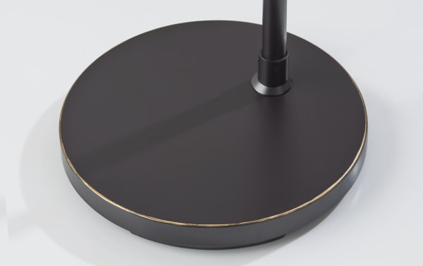 Round brown steel base of the Romy 68'' Antique Bronze Arc Floor Lamp with mid-century modern style and rotary switch for easy on/off.