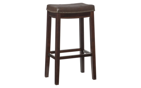 Ryann Brown Faux Leather Backless Bar Height Stool with dark brown rubberwood frame, polyurethane upholstery, brass nailhead trim, traditional style.