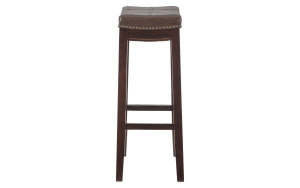 Ryann Brown Faux Leather Backless Bar Height Stool with dark brown rubberwood frame, traditional style, and stitched polyurethane upholstery with brass nailhead trim.