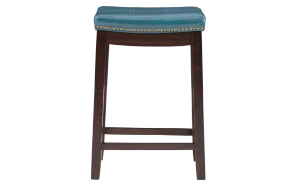 Ryann Blue backless counter height stool with blue faux leather polyurethane seat, antique brass nailhead trim, and dark rubberwood frame.