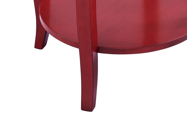 Loudain Red Round Table with transitional style, MDF and rubberwood solids, featuring a red finish, round top, bottom shelf, and tapered saber cabriole legs.