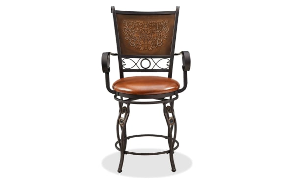 Traditional brown Friseal Copper faux leather panel back counter height stool with vinyl upholstered seat, steel frame, curved arms, and intricate stamped back.